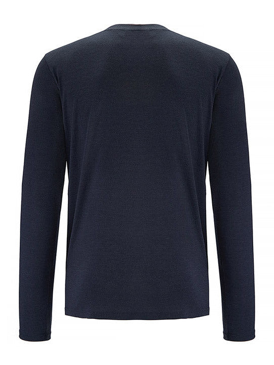 A back view of the Base One Longsleeve Men Navy shirt is displayed. Produced by We Norwegians from merino wool, this long-sleeved garment features a simple, solid design without any visible logos or patterns. The fabric looks soft and has a slightly fitted cut, creating a slim fit style.