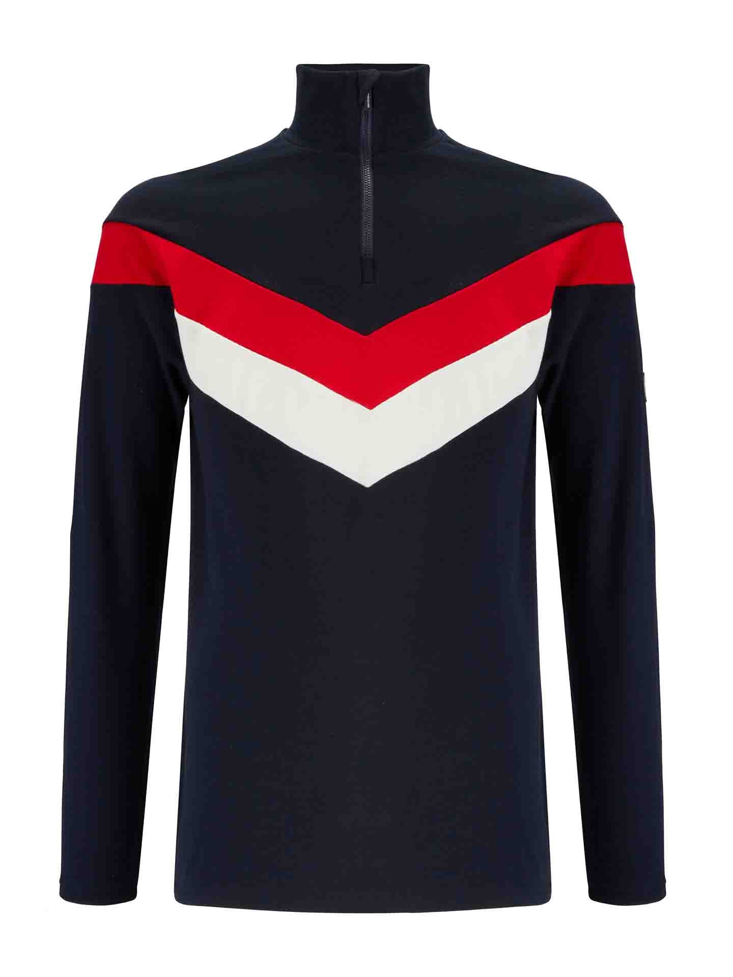 The Voss Colblock 1/4 Zip Men Flag pullover from We Norwegians is a long-sleeve Merino top in navy blue, featuring a bold red horizontal stripe across the chest above a white chevron pattern pointing downward. Its high collar neckline includes a front zipper for added style, creating an eye-catching color block effect.