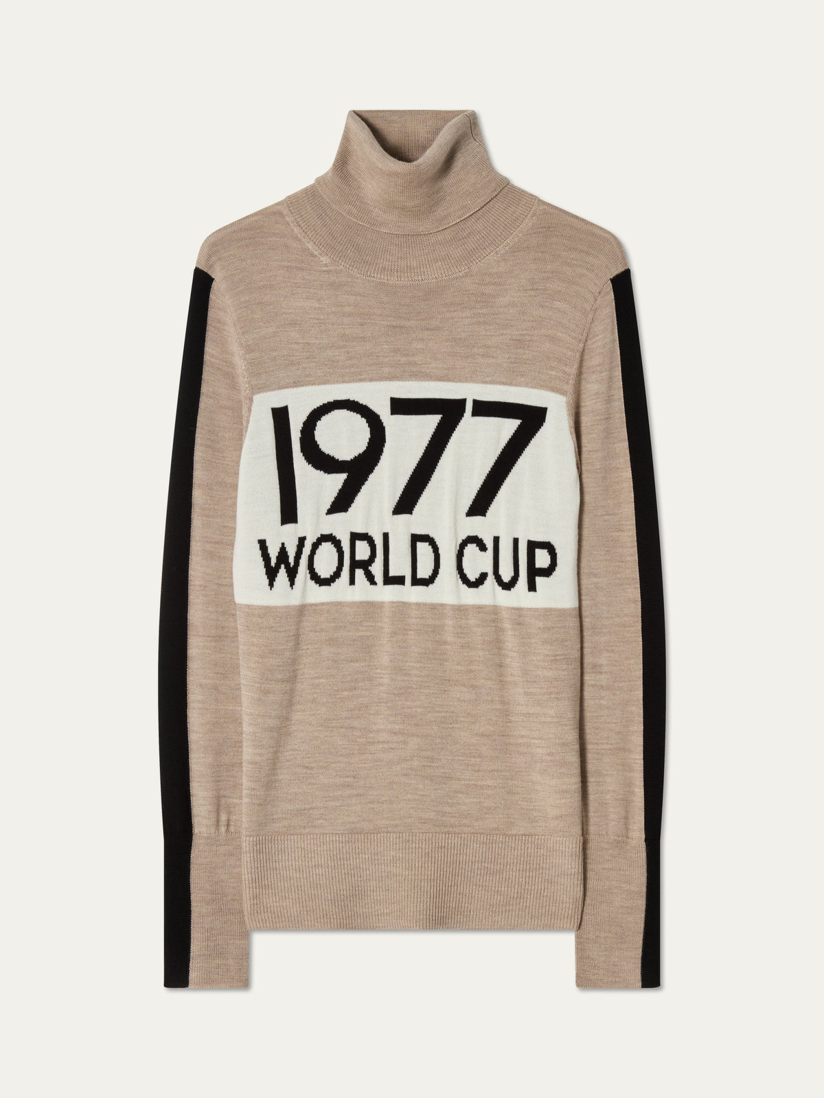 The 1977 World Cup Sweater Women by We Norwegians features a beige turtleneck design with black side stripes and a white front panel boldly displaying “1977 WORLD CUP,” perfectly capturing the essence of retro ski fashion.