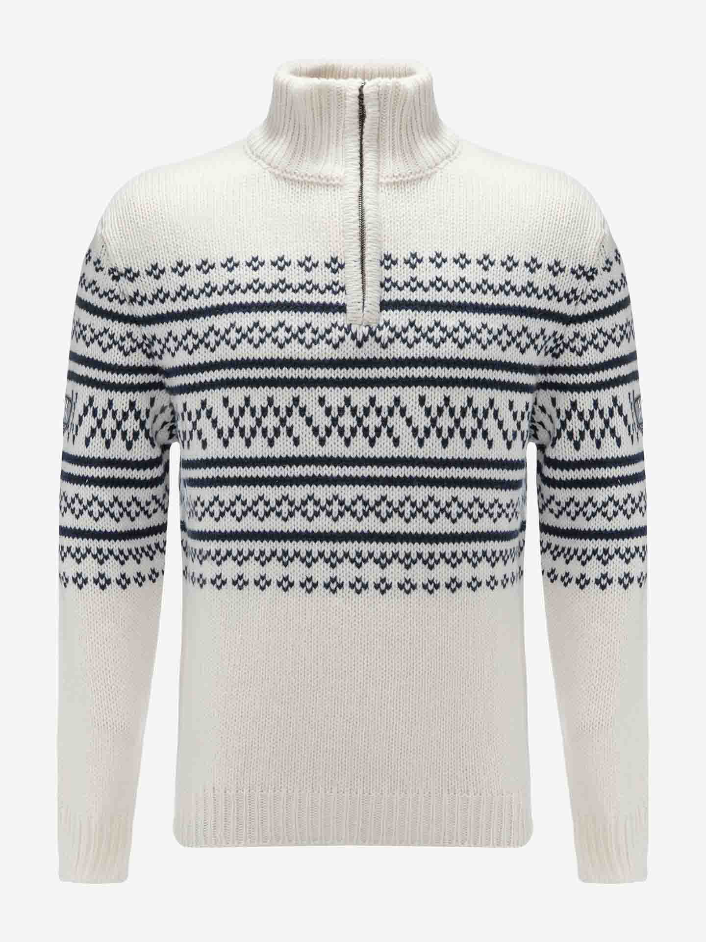 The Setesdal Zip Up Sweater Men Off White by We Norwegians is a white merino wool sweater featuring a high collar and a half-zip design. Adorned with intricate black and blue Nordic-style patterns across the chest, sleeves, and upper body, it’s perfect for après ski outings. The hem and cuffs are ribbed for a snug fit to keep you cozy.