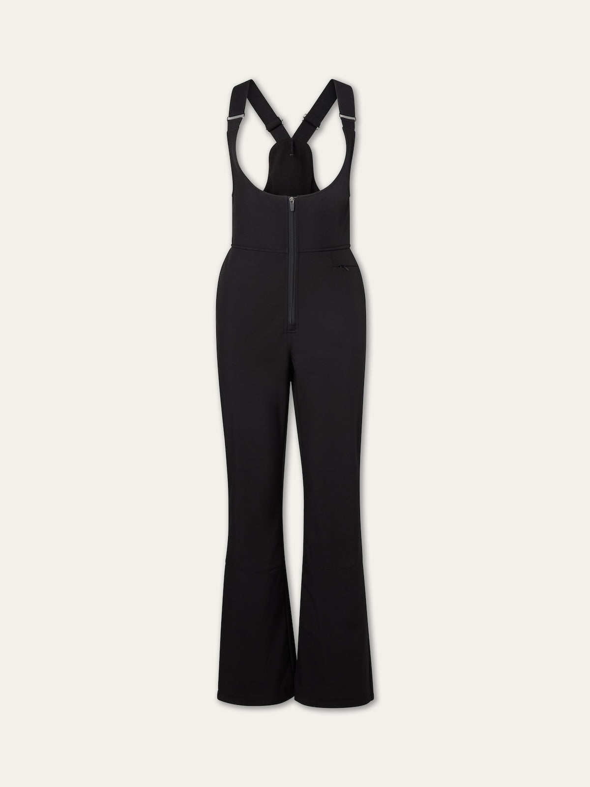 The Tyin Bib Pant Women by We Norwegians is a black high-waisted bib with flared legs, adjustable shoulder straps, and a front zipper, crafted for alpine performance and shown on a plain light background.