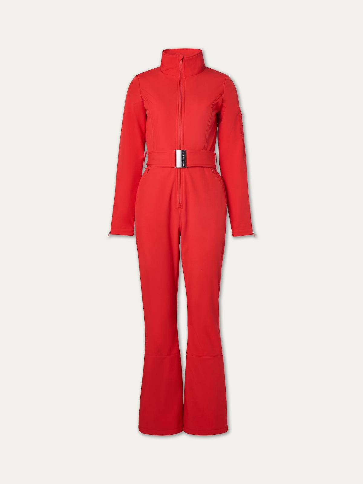 The We Norwegians Tyin Ski Suit for women in bright red features a water-repellent soft shell, long sleeves, high collar, front zipper, wide-leg pants, and matching belt, shown on a plain light background.