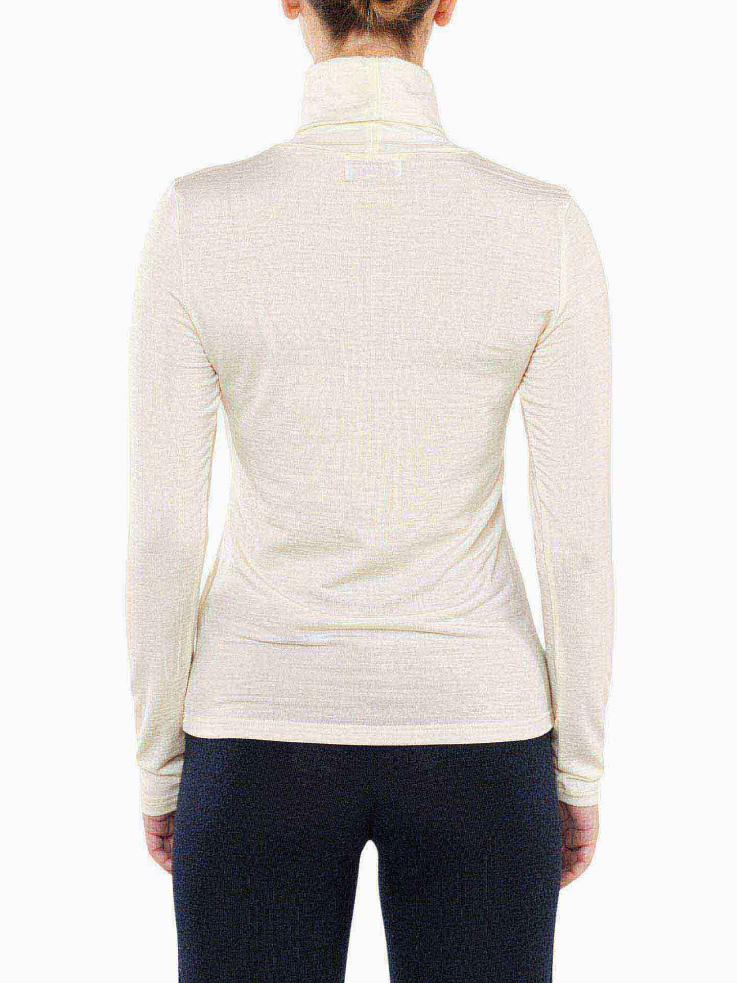 Back view of a person wearing the Hygge Turtleneck Women by We Norwegians, paired with dark pants. The hair is tied up, and the light-colored, long-sleeve luxury base layer accentuates the contours of the upper body and arms. Only the upper half of the body is visible.