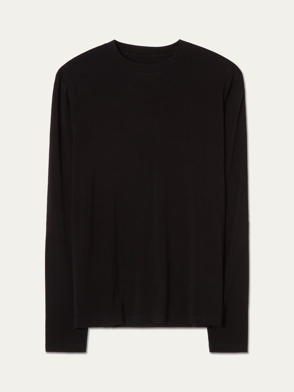 The Sno Merino Long Sleeve Men by We Norwegians, a plain black merino wool top, is displayed flat on a light off-white background.