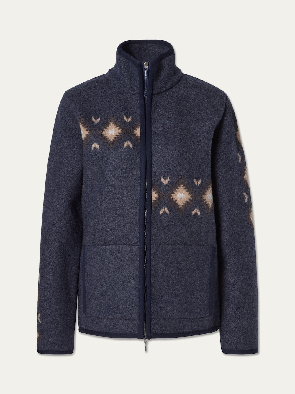 The We Norwegians Hovden Jacket Men features a navy blue boiled merino wool construction with a zip-up front, high collar, two front pockets, and a geometric beige pattern across the chest and sleeves. Inspired by traditional Norwegian Sámi design, this luxury midweight layer seamlessly blends heritage style with modern comfort.