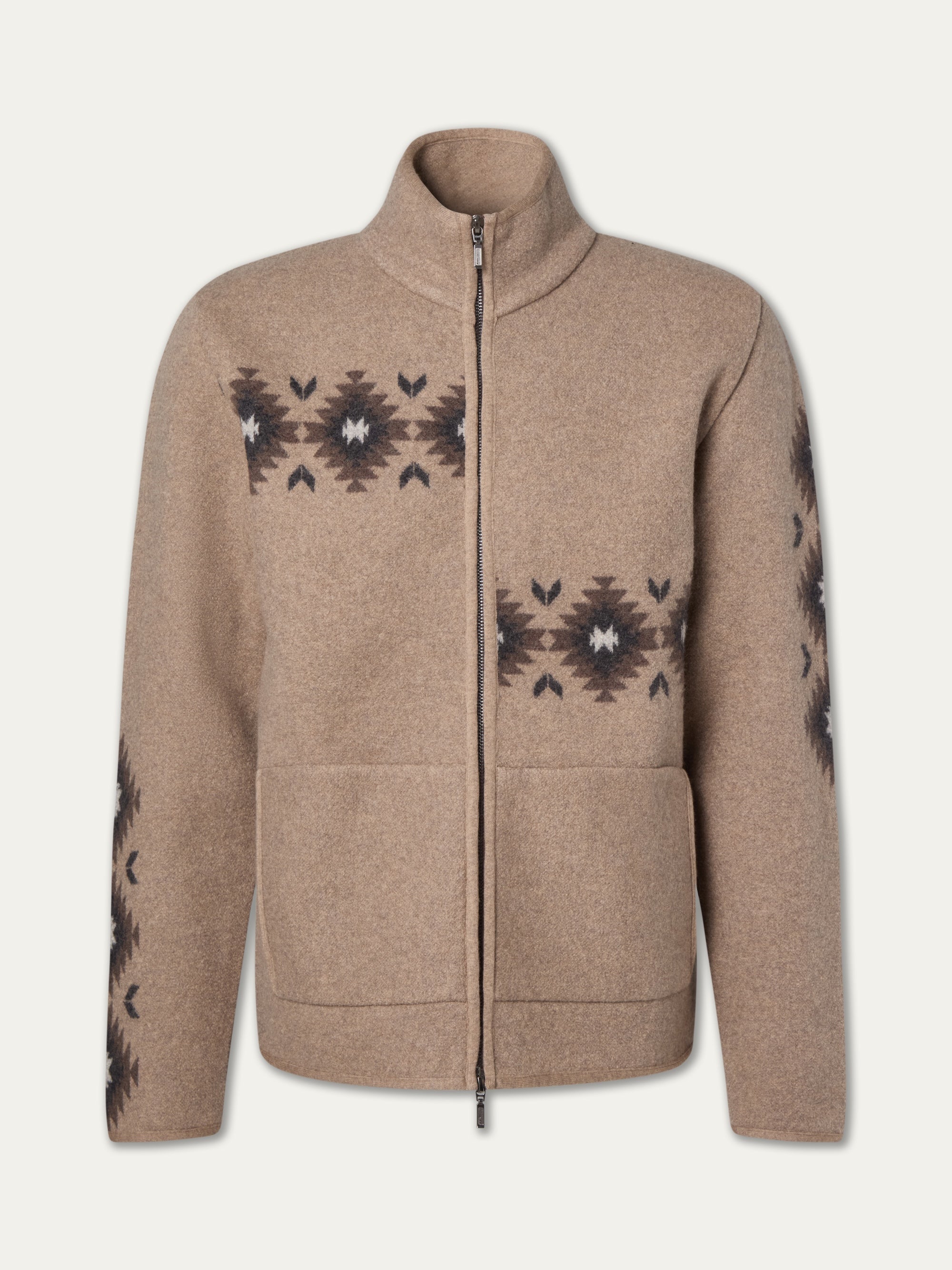 The We Norwegians Hovden Jacket Men is a tan, Sámi-inspired zip-up boiled Merino wool jacket with a high collar, two front pockets, and black geometric patterns with white accents on the chest, sleeves, and sides.