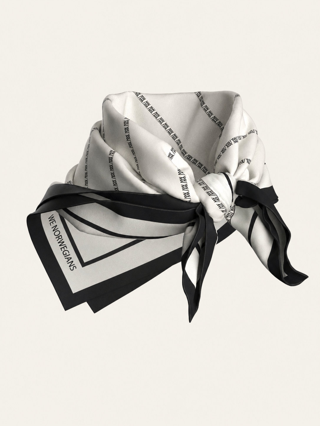 The We Norwegians Ship Silk Scarf is a square silk-twill accessory in black and white, adorned with thin lines and text details, including the "WE NORWEGIANS" signature in one corner. Displayed on a neutral background, this elegantly tied scarf is an elevated designer piece for any wardrobe.