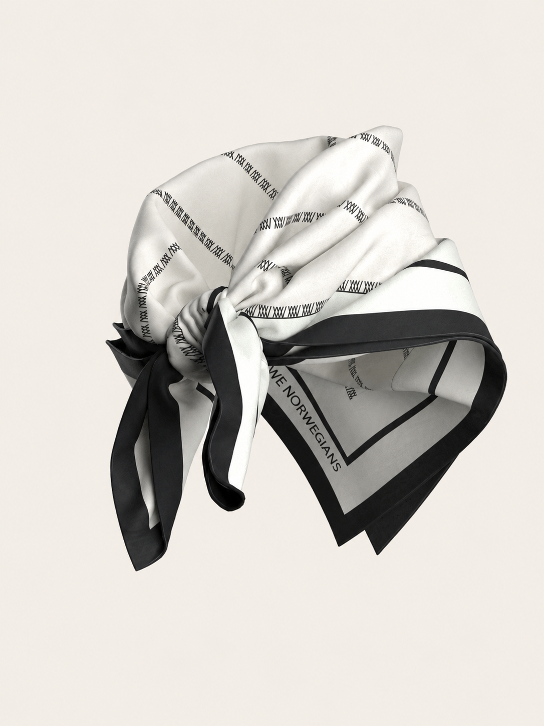 The We Norwegians Ship Silk Scarf—a white silk-twill accessory featuring black borders and fine black text—is elegantly styled in a loose knot against a simple light backdrop.