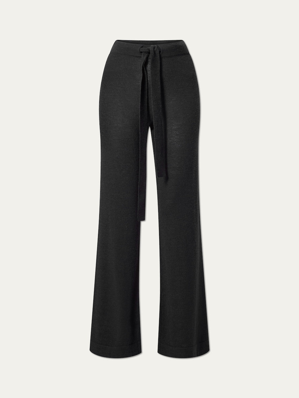 We Norwegians Geilo Belted Pant Women: black wide-leg knit lounge pants with a high waist and matching fabric tie belt, shown against a plain light background.