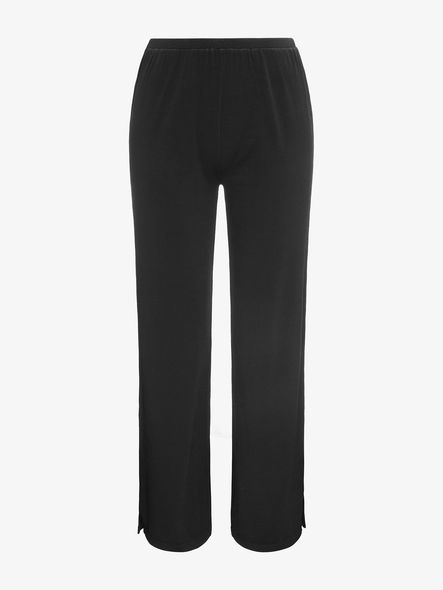 The Natt PJs Pants Women Black by We Norwegians are a pair of black, loose-fitting pants with an elastic waistband. Crafted from luxurious Merino wool pajamas fabric, they offer unparalleled softness and flow. Small slits at the bottom of each leg add a touch of style. The plain white background showcases these limited edition pajamas beautifully.