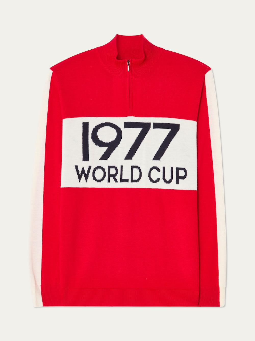 The We Norwegians 1977 World Cup Zipup Men is a red, long-sleeve sweater with a white chest panel and bold black "1977 WORLD CUP" text.