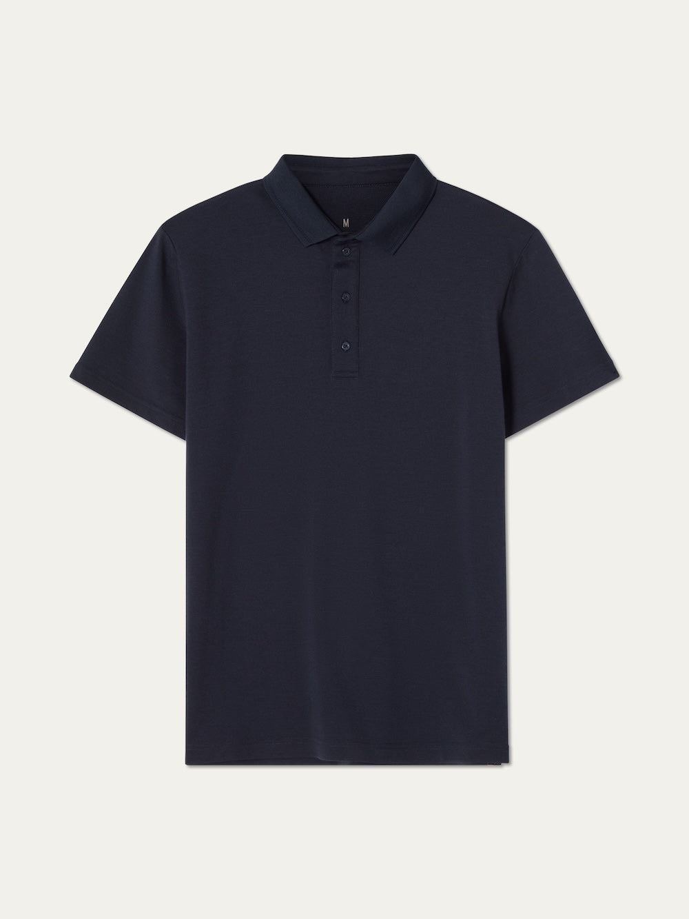 The We Norwegians Medalist Piqué Polo Men is a navy blue, short-sleeved moisture-wicking collared shirt with three buttons on the placket, shown flat against a light background.