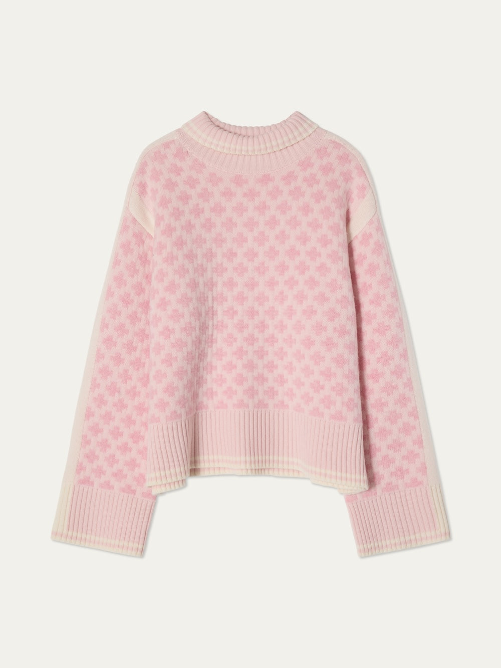 The We Norwegians Boat Sweater women - Pre Spring 26 is a light pink and white knit with a checkered pattern, long sleeves, ribbed cuffs and hem, and features a relaxed, slightly oversized fit.