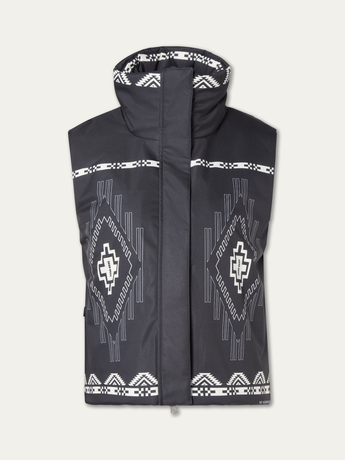 The We Norwegians Pioneer Padded Vest for women is black with a high collar and features white geometric and tribal-inspired patterns on the front and collar, shown against a plain light background.