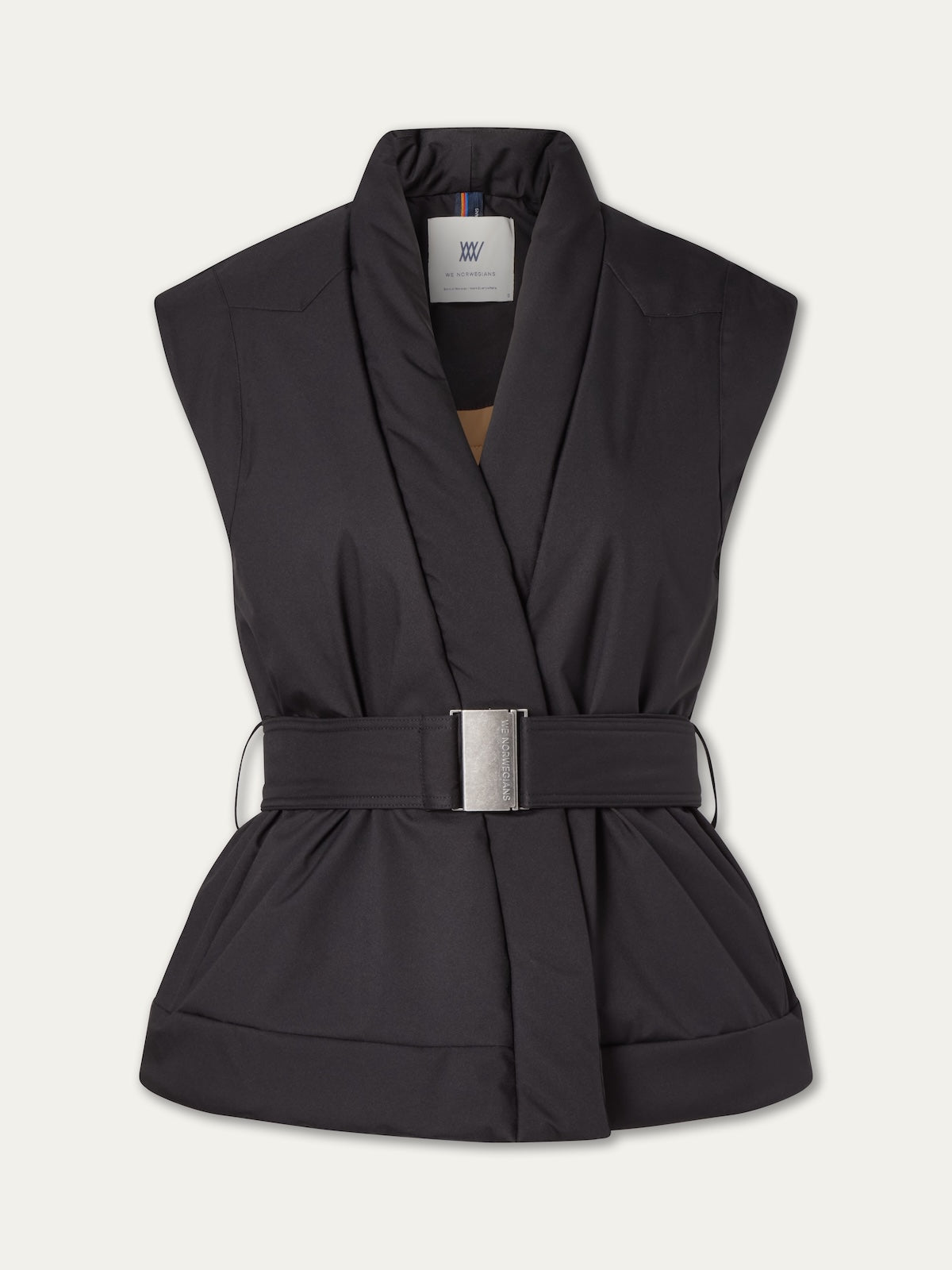 The We Norwegians Western Vest women is a sleeveless black vest inspired by vintage ski styles, with a wide shawl collar, cinched waist, fabric belt with a large silver buckle, and a visible back neck label inside.
