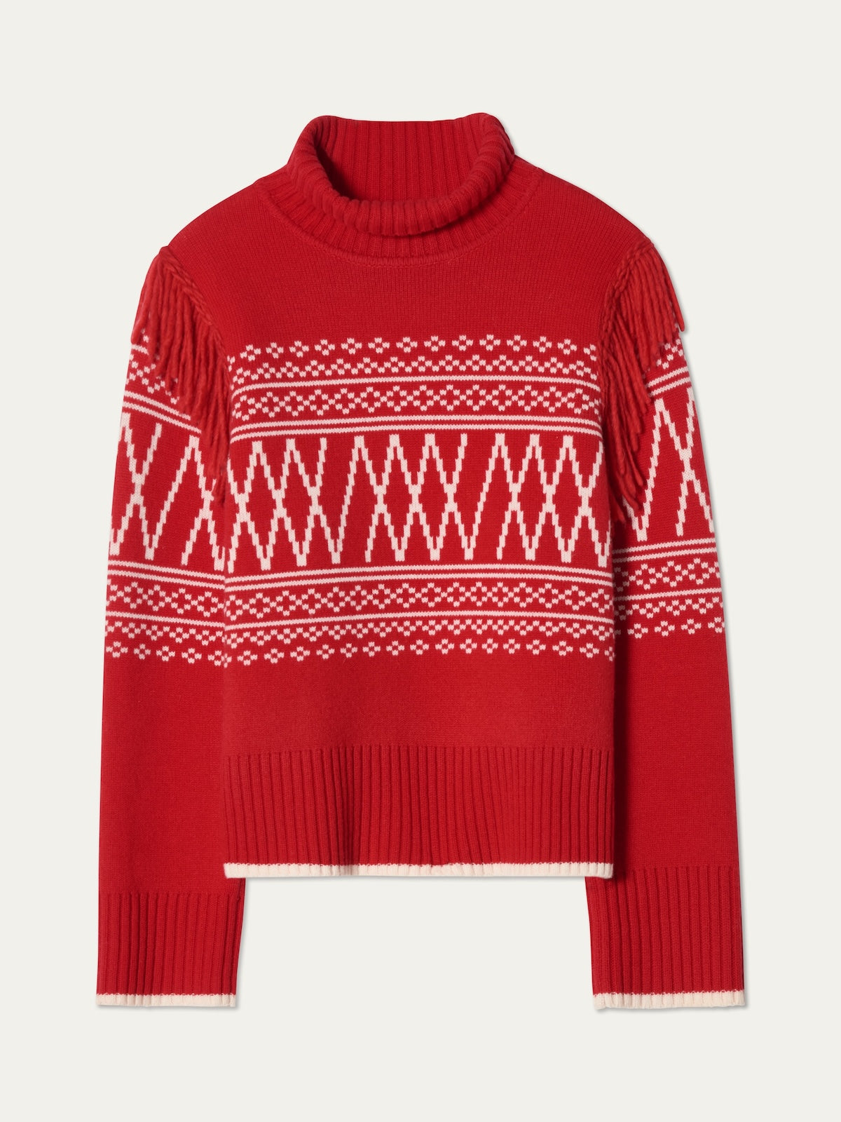 The Setesdal Sweater women by We Norwegians is a red knit turtleneck with white geometric patterns, fringed shoulders, long sleeves, and ribbed cuffs and hem—classic Norwegian style in a cozy design.