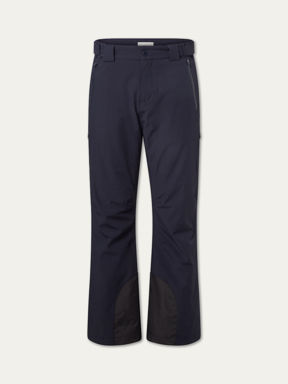 The Hammerfest Ski Pant men by We Norwegians are navy blue, featuring belt loops, button and zip closure, front zipper pockets, and reinforced black fabric at the inner ankles. Displayed against a plain white background.