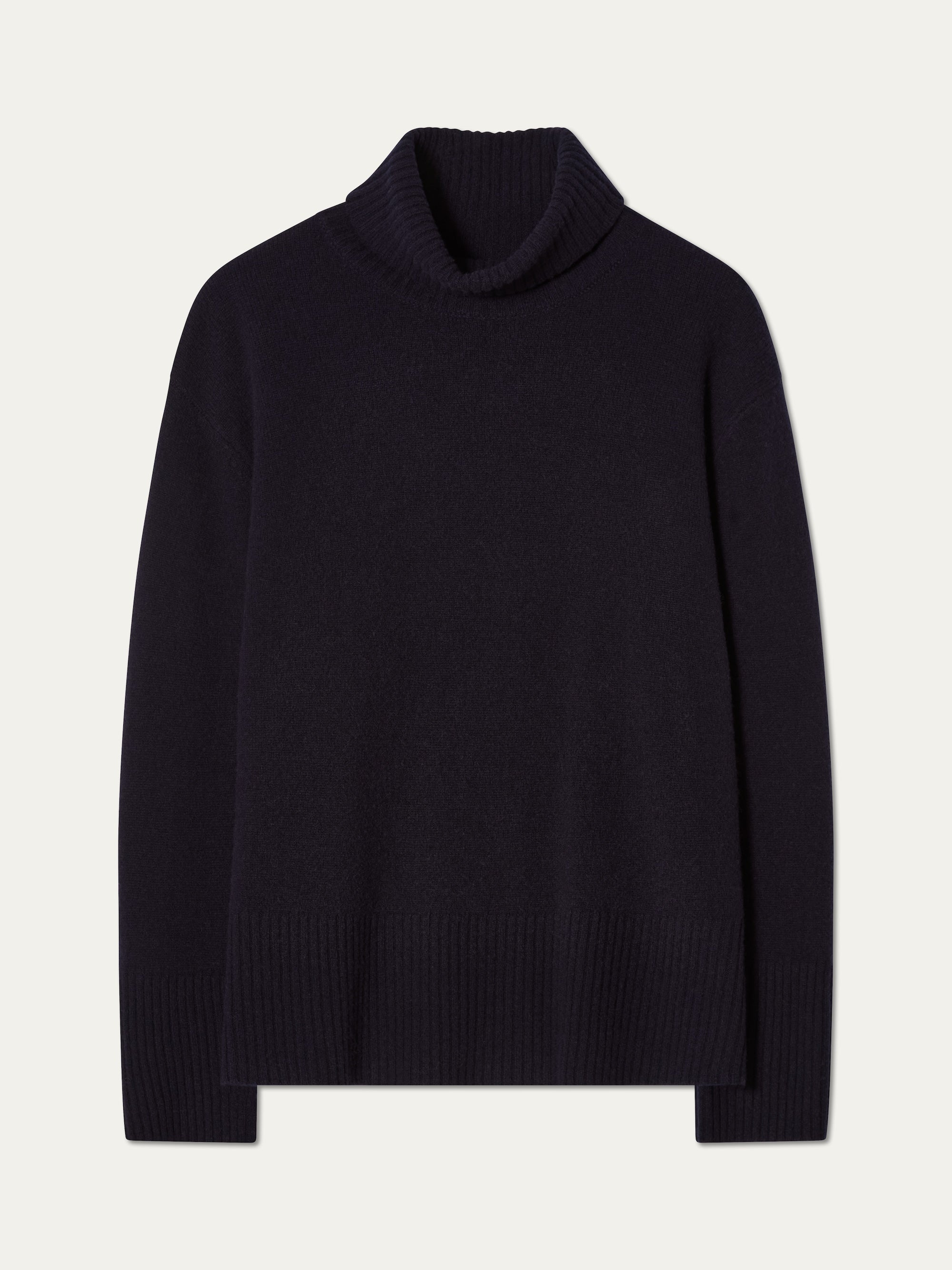 The Geilo BoyFriend Sweater for women by We Norwegians, in black Extrafine Merino Wool with ribbed cuffs, hem, and neck, features long sleeves and a turtleneck. Shown laid flat on a plain white background.