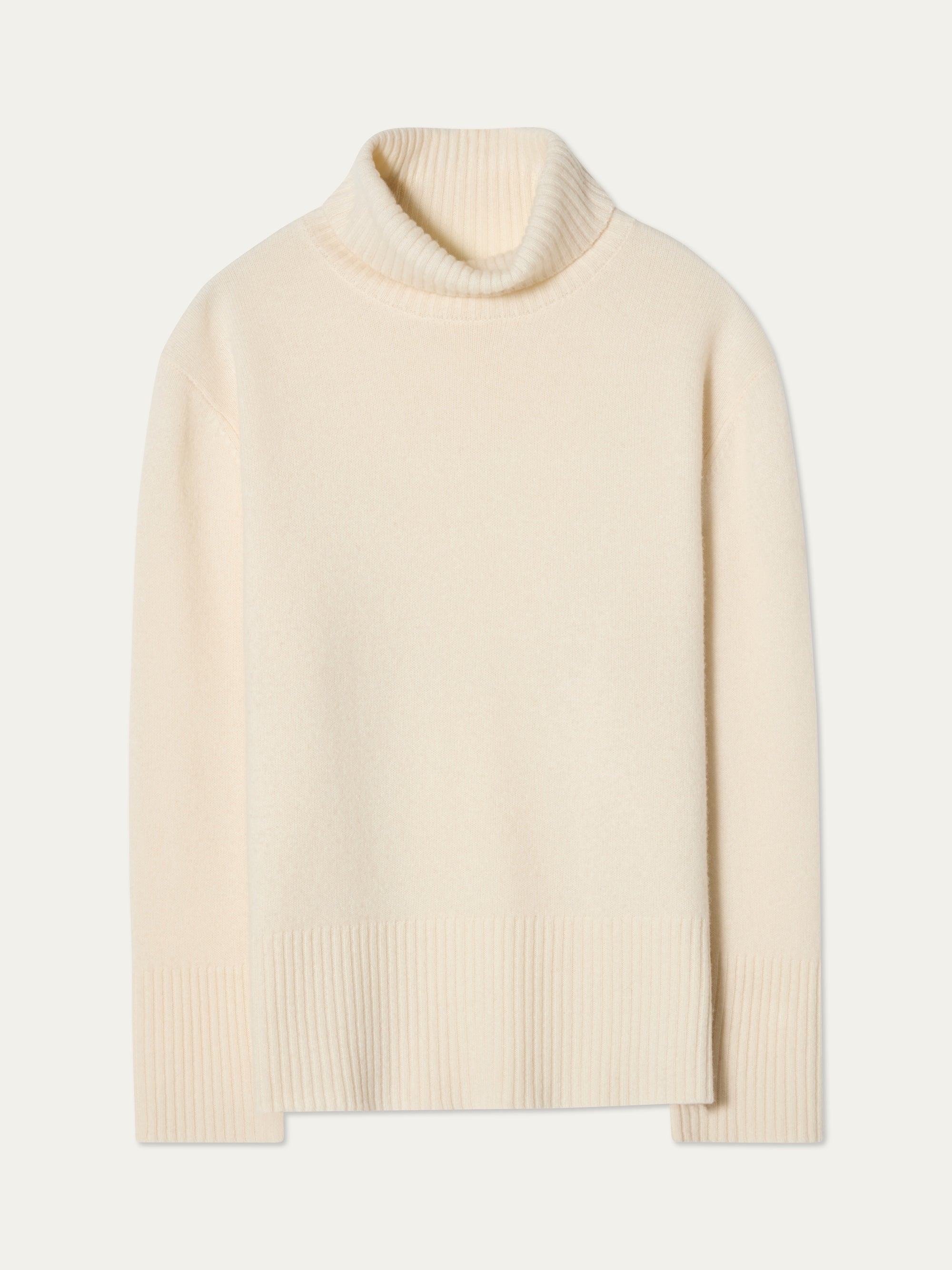 The Geilo BoyFriend Sweater for women by We Norwegians is a cream, long-sleeve turtleneck in Extrafine Merino Wool with ribbed collar, cuffs, and hem, shown laid flat on a plain background.