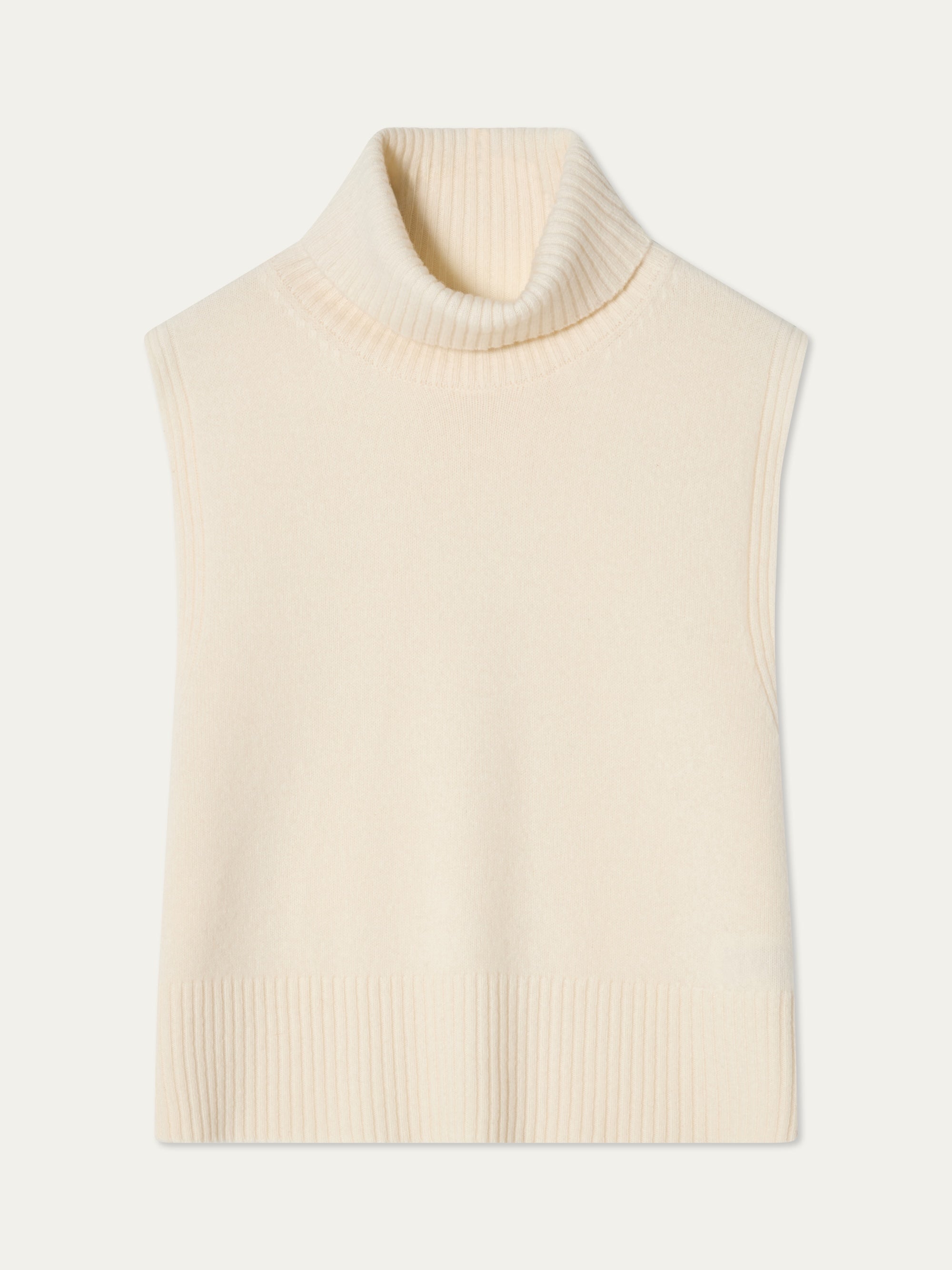 The Geilo Vest women by We Norwegians is a cream knit sleeveless turtleneck sweater crafted from extrafine merino wool with ribbed detailing at the neck, armholes, and hem, shown laid flat on a white background.