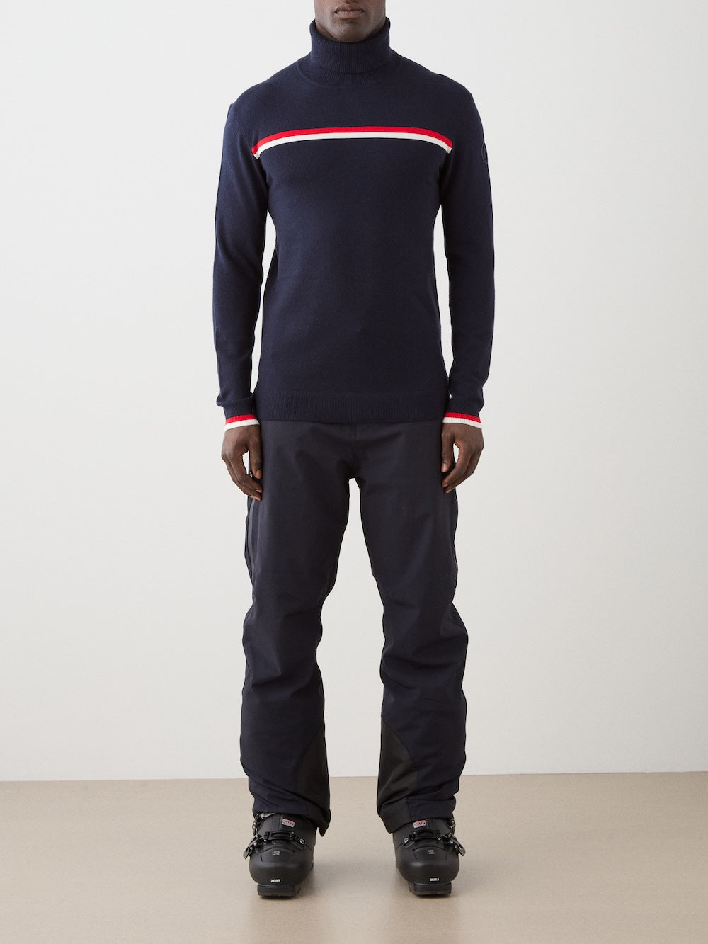 We Norwegians | FW25 | Mens Freebird Turtleneck | Person wearing a navy turtleneck with red and white stripes and matching pants on a plain background