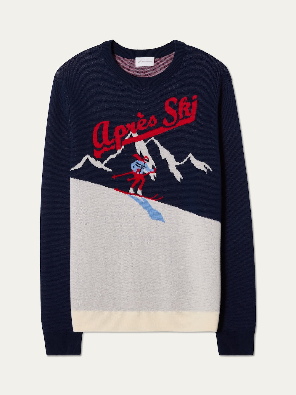 The We Norwegians AfterSki CrewNeck men is a navy blue sweater featuring a skier on a snowy mountain, "Après Ski" in red script, plus white and grey accents—ideal for cozying up on your next winter getaway.