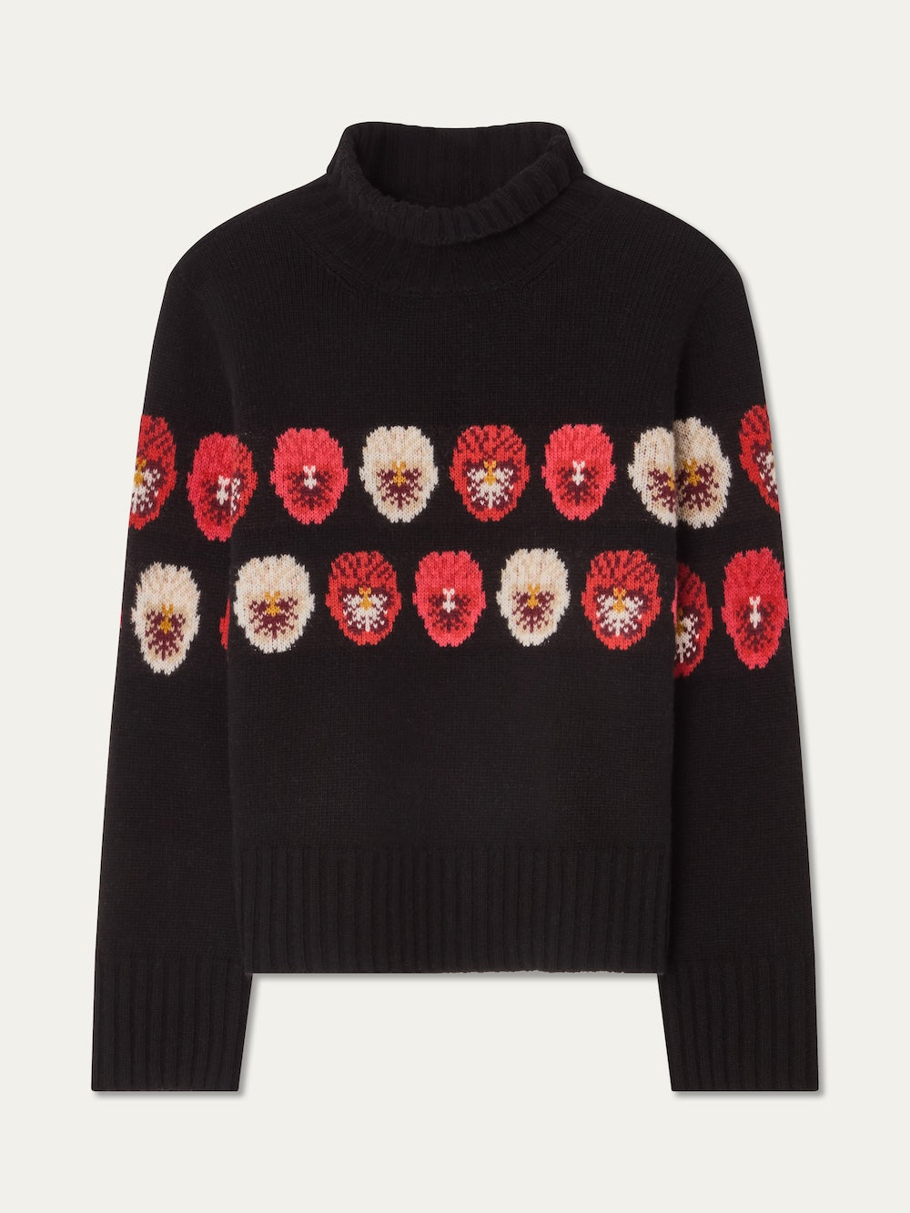 The We Norwegians WN x Markarian Sweater for women is a black Fair Isle knit with two horizontal rows of red, white, and pink floral patterns across the chest and sleeves.