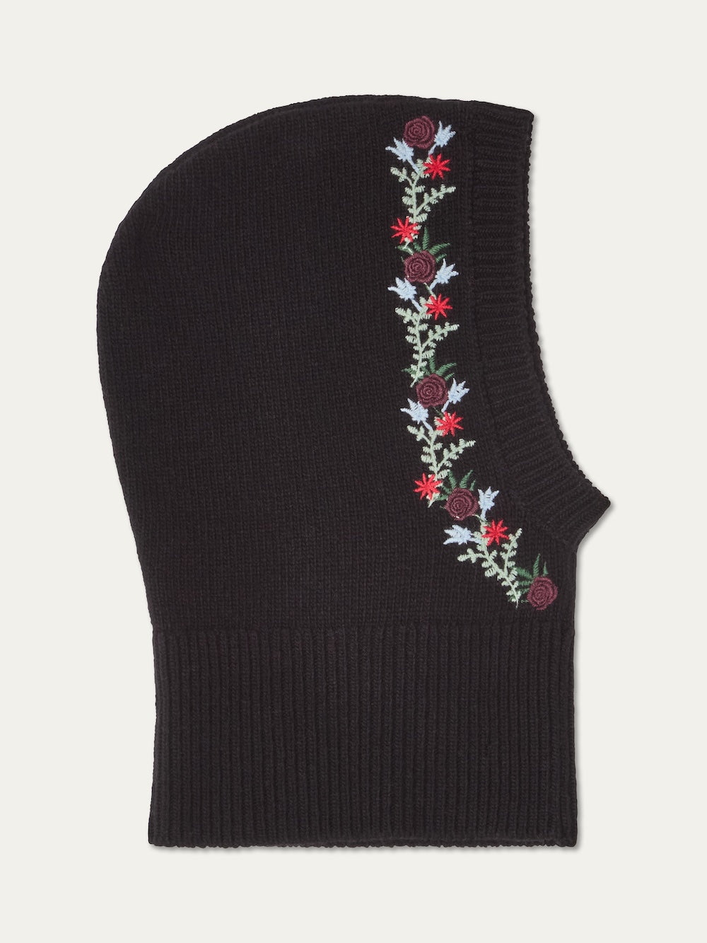 The WN x Markarian Balaclava women by We Norwegians is a limited edition wool balaclava featuring vertical floral embroidery with red, purple, and blue flowers plus green leaves along one side.