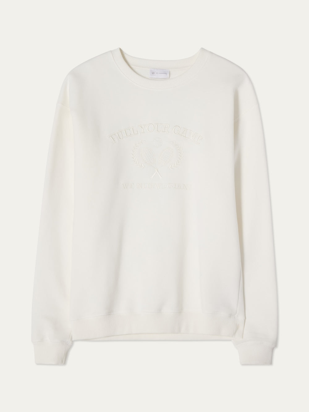 The We Norwegians Bounce Sweater Women is a white crewneck with subtle tennis embroidery and embossed front text, long sleeves, and ribbed cuffs and hem, shown against a white background.