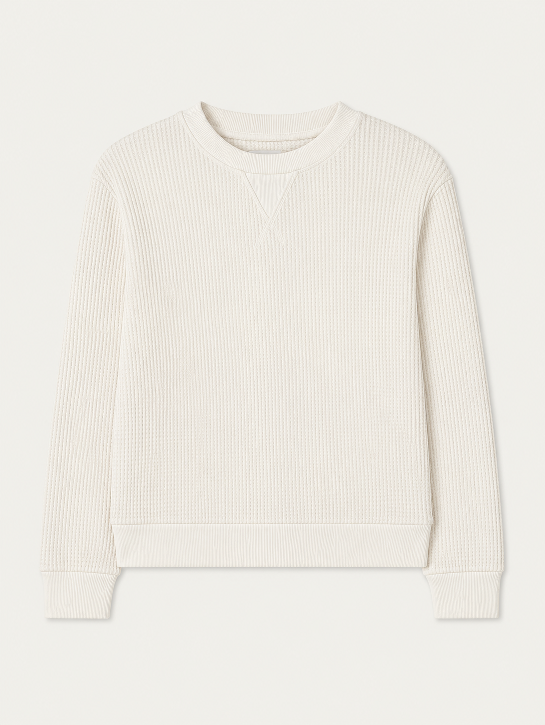 The We Norwegians Waffle Crewneck Women is a cream long-sleeve sweatshirt with ribbed cuffs, collar, and hem in a relaxed fit, shown laid flat on a white background.