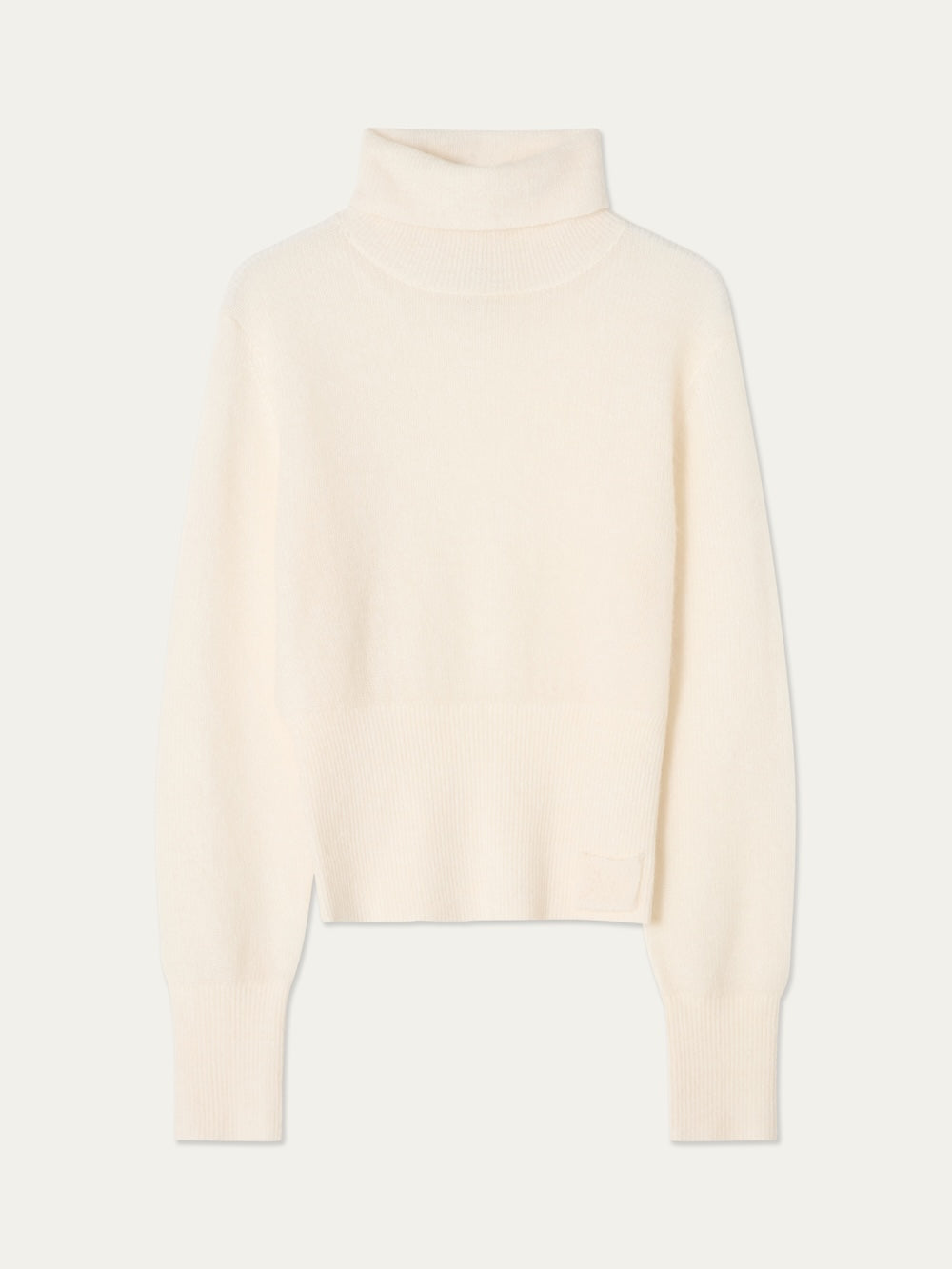 The Pudder Sweater Women by We Norwegians is a cream-colored, long-sleeve turtleneck crafted from cozy mohair yarn, featuring ribbed cuffs and hem, and is displayed on a plain light background.