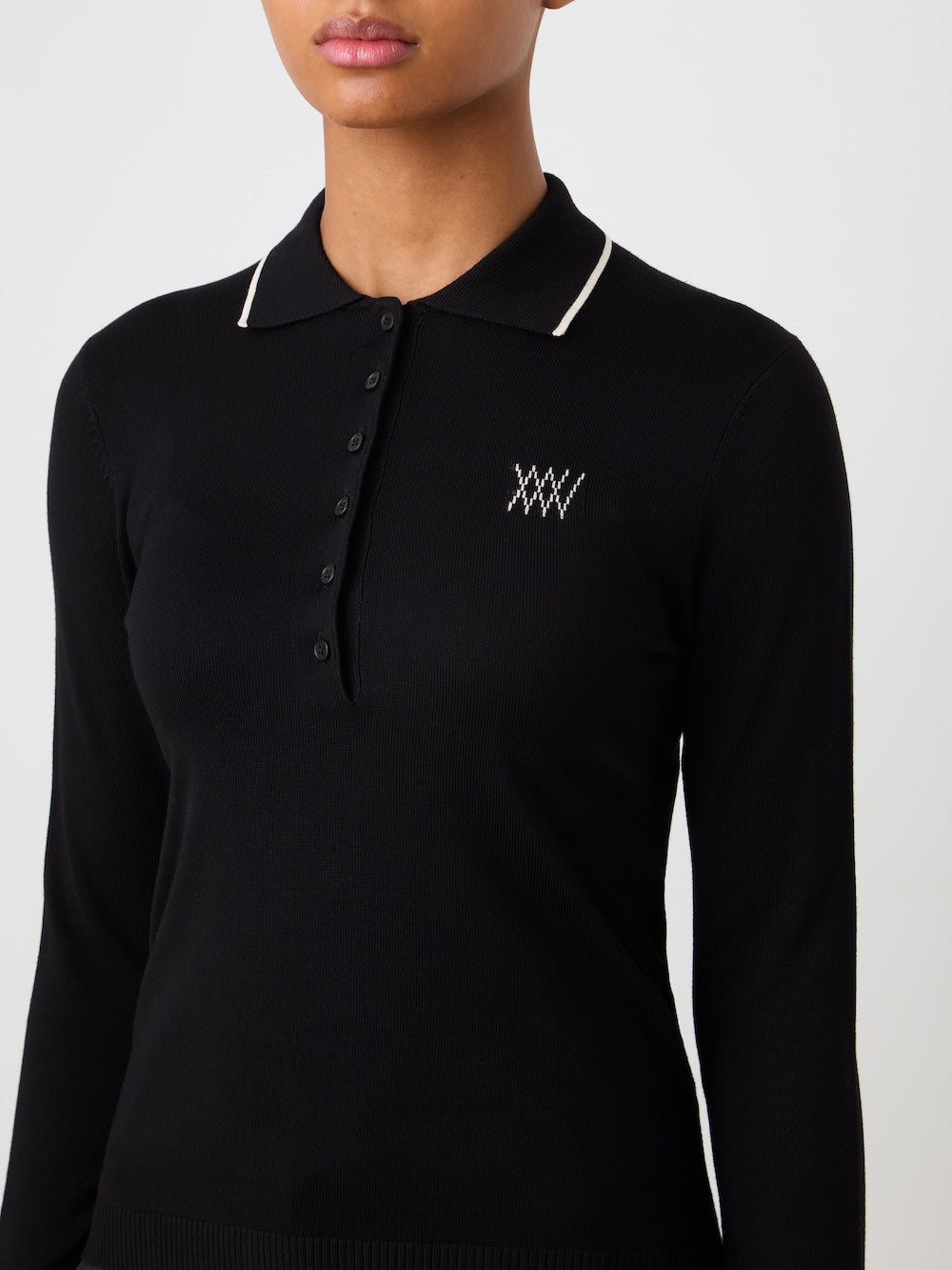Black long-sleeve polo shirt with a logo on a plain background
