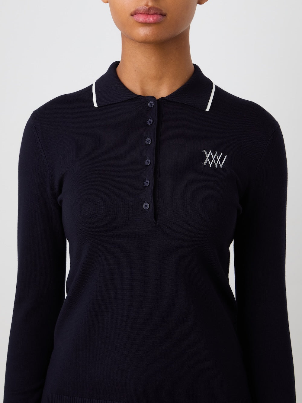 Navy blue long-sleeve polo shirt with a logo on a plain background
