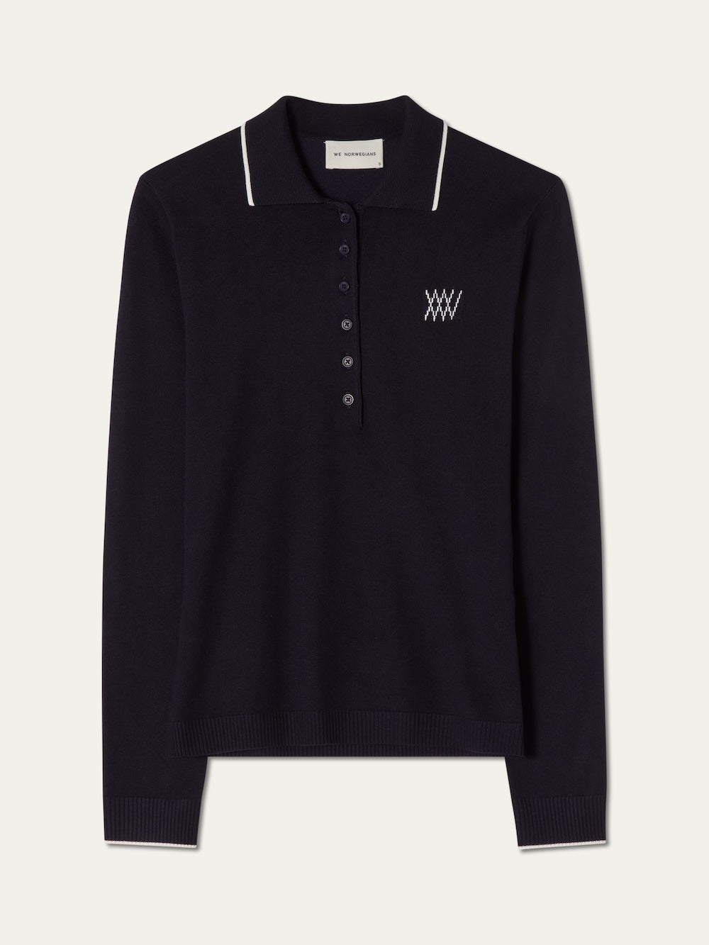 Navy blue long-sleeve polo shirt with white details on an off white background