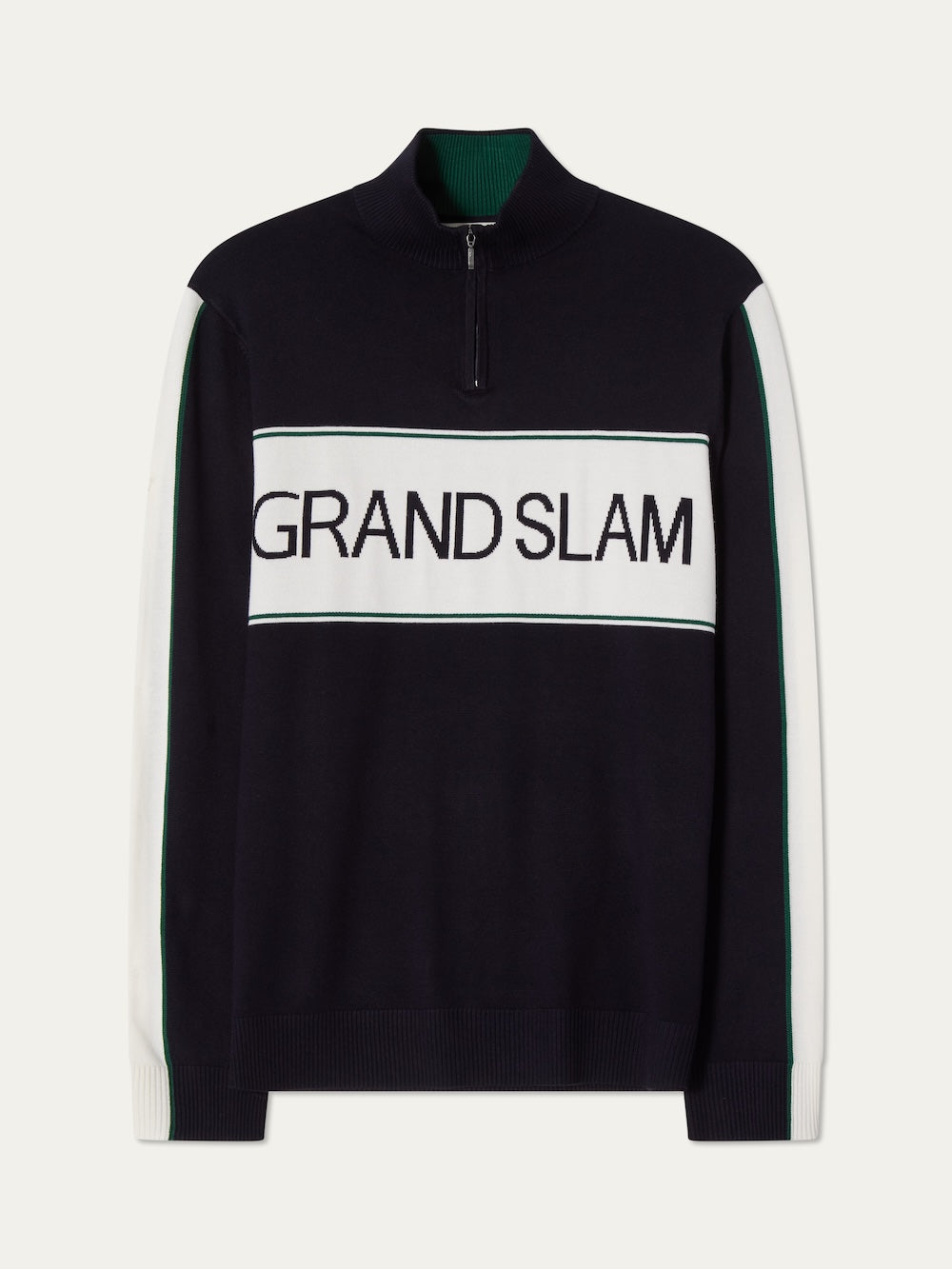 The We Norwegians Grand Slam Sweater Men features a navy blue design with white and green sleeve stripes and "GRAND SLAM" in bold black letters on a white chest panel—ideal for vintage-inspired après sport style.