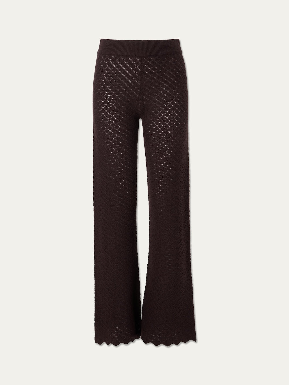 The We Norwegians Saeter Pant Women, featuring brown pointelle knit and a wide-leg silhouette with a scalloped hem, is displayed on a plain light background.