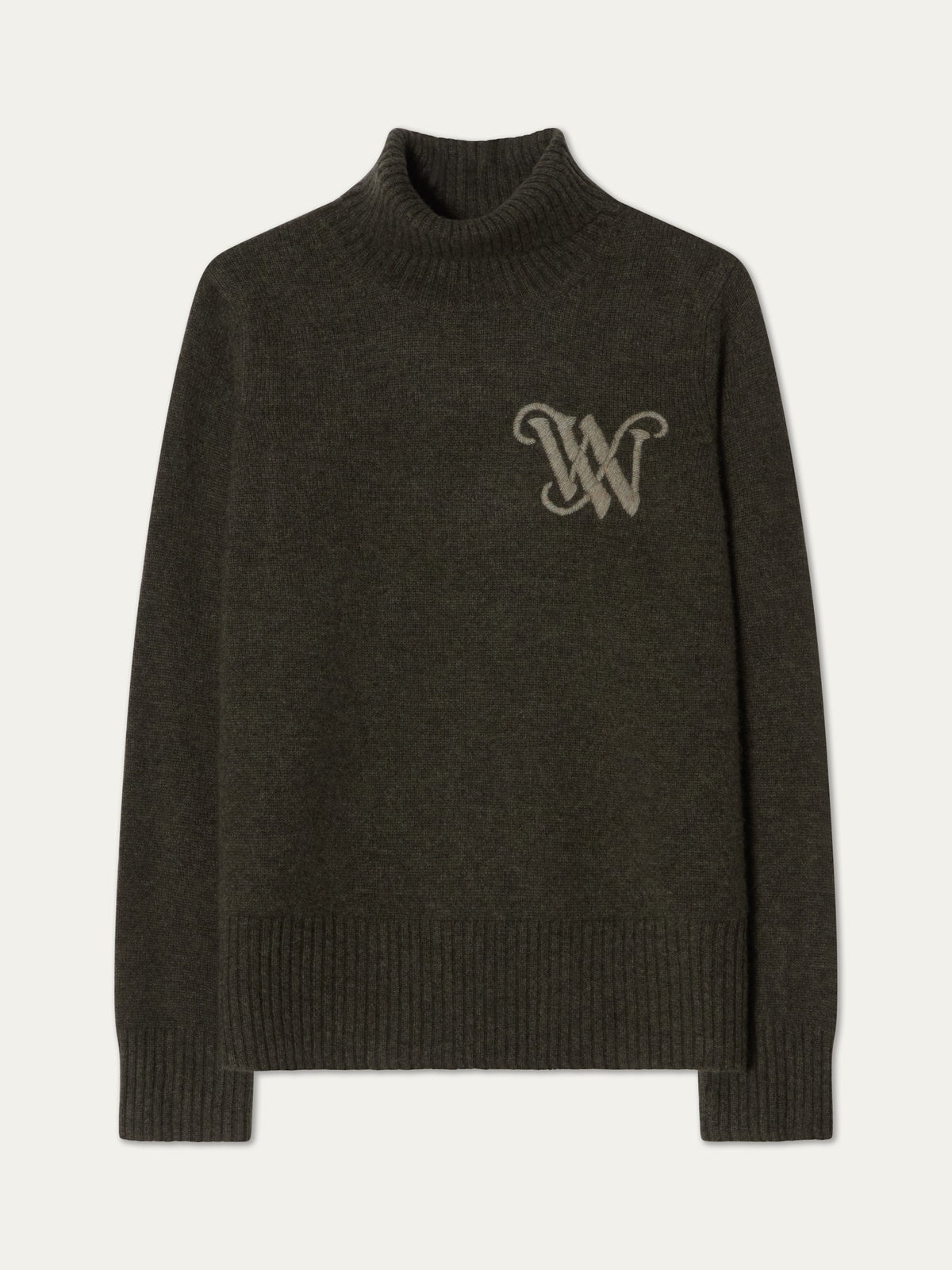 We Norwegians Monogram Cashmere Sweater Women in dark olive green, featuring a mock-neck and a large, light-colored embroidered monogram logo on the chest.