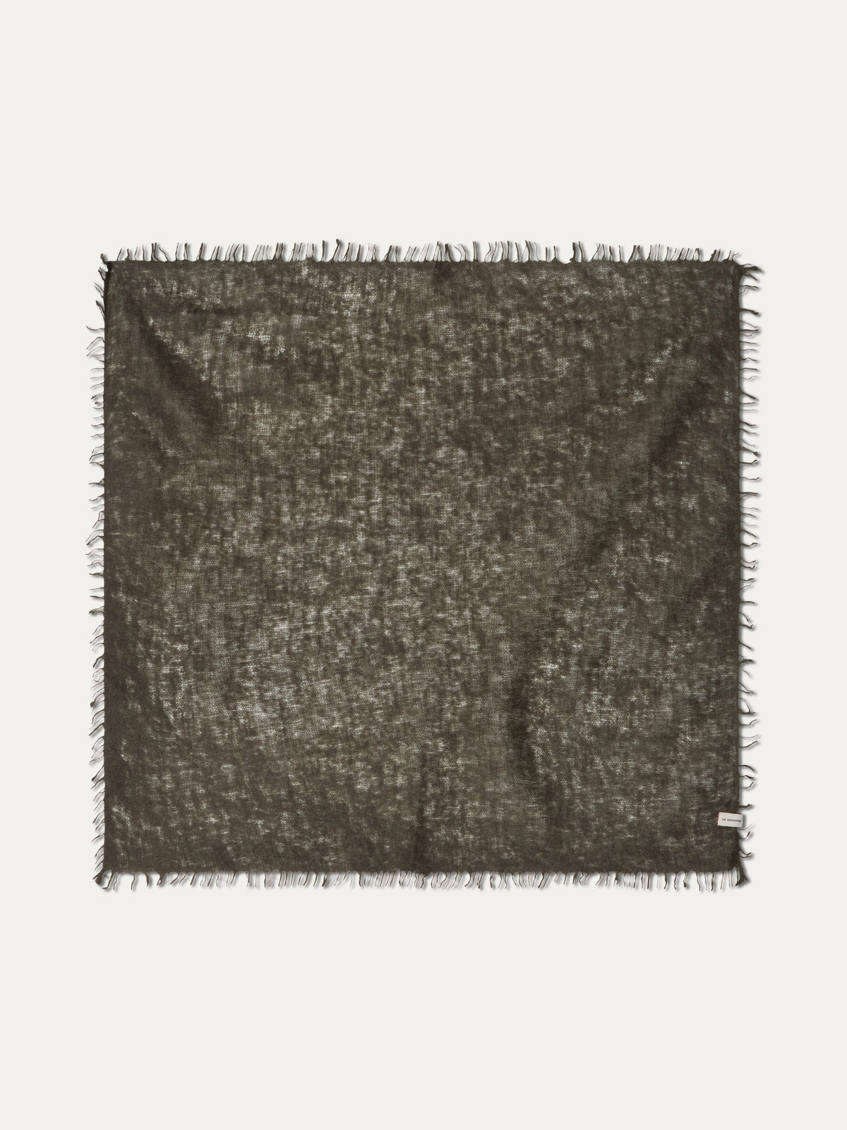 Square, featherlight dark olive Monogram Cashmere Scarf by We Norwegians with a frayed fringe edge.