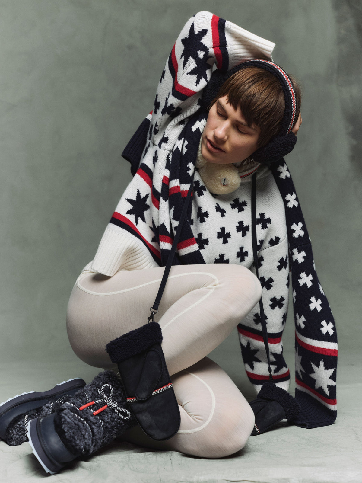 EMU x WN Sweater Women - Model is wearing the Off white sweater with the EMU x WN Blurred teddy boots, EMU x WN Angahook earmuffs and EMU x WN Montana mittens