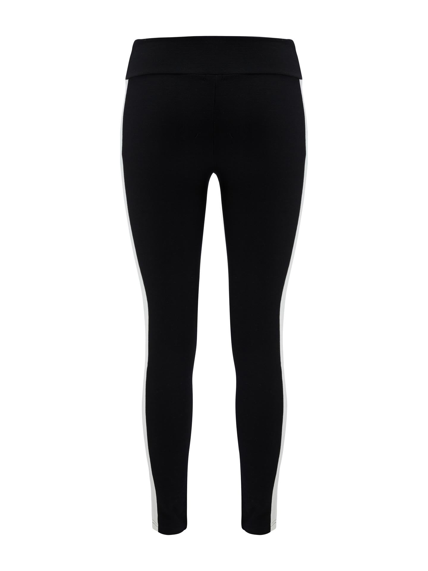 A pair of Voss Leggings Women by We Norwegians, featuring a black hue with a wide waistband and white race stripe design. These leggings extend to the ankles and boast a sleek, form-fitting silhouette, making them an ideal stylish base layer.