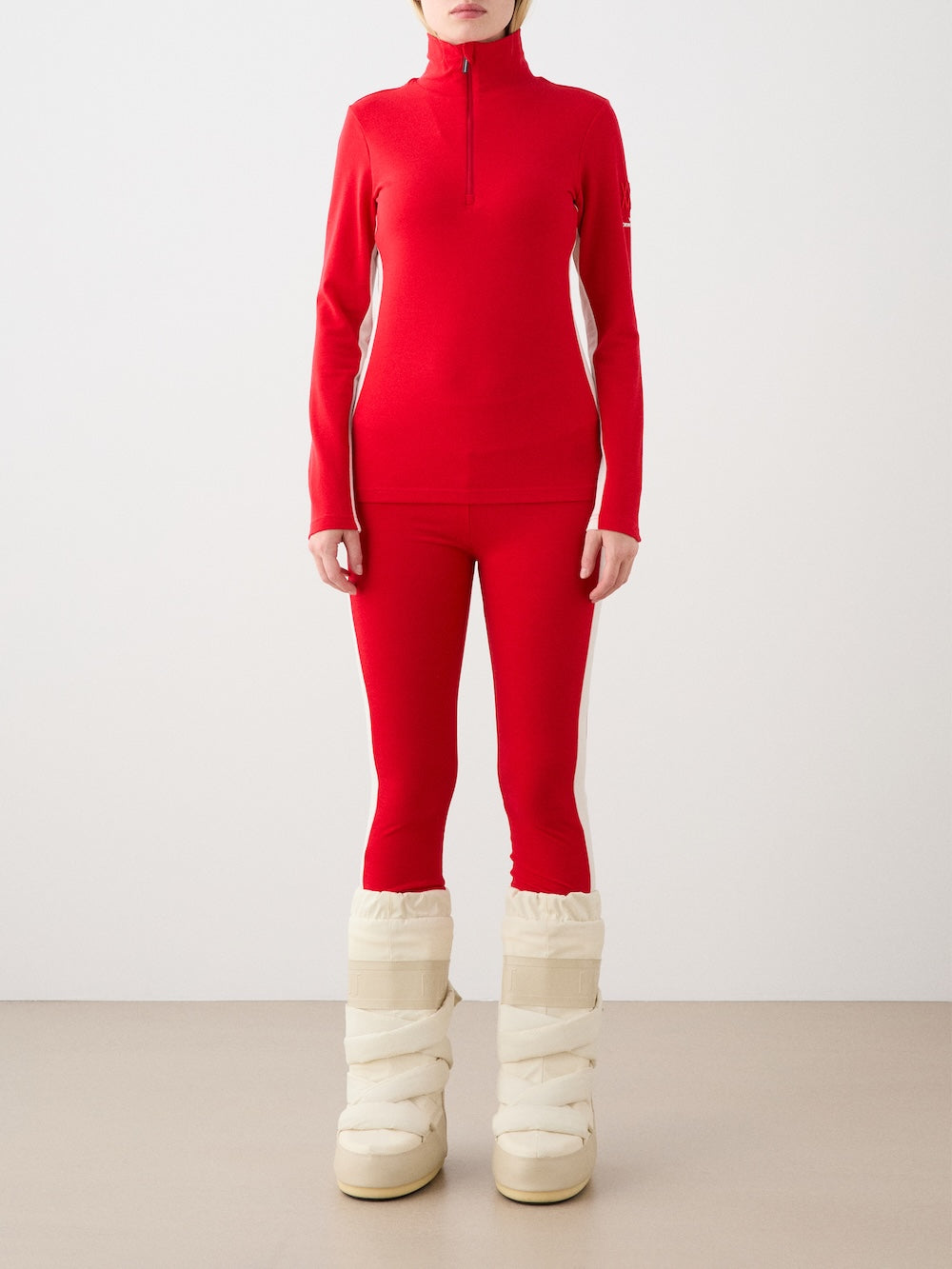 We Norwegians | FW25 | Womens Voss Leggings_Red | Model wearing this fine knitted pair of leggings with contrasting panels on the sides on an off-white background | A perfect base layer or work-out wear | Front