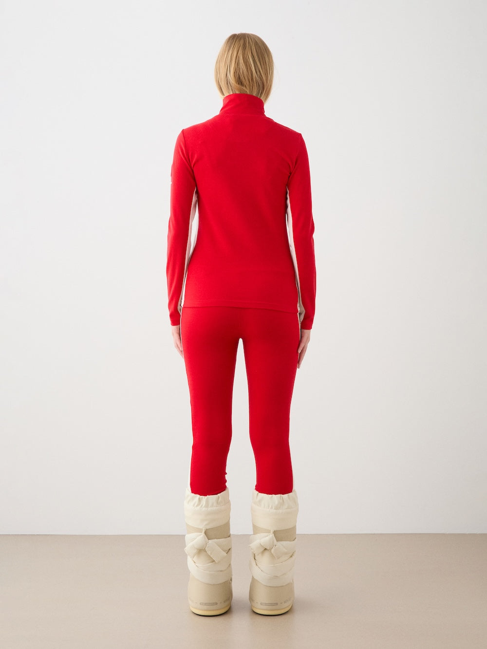 We Norwegians | FW25 | Womens Voss Leggings_Red | Model wearing this fine knitted pair of leggings with contrasting panels on the sides on an off-white background | A perfect base layer or work-out wear | Back