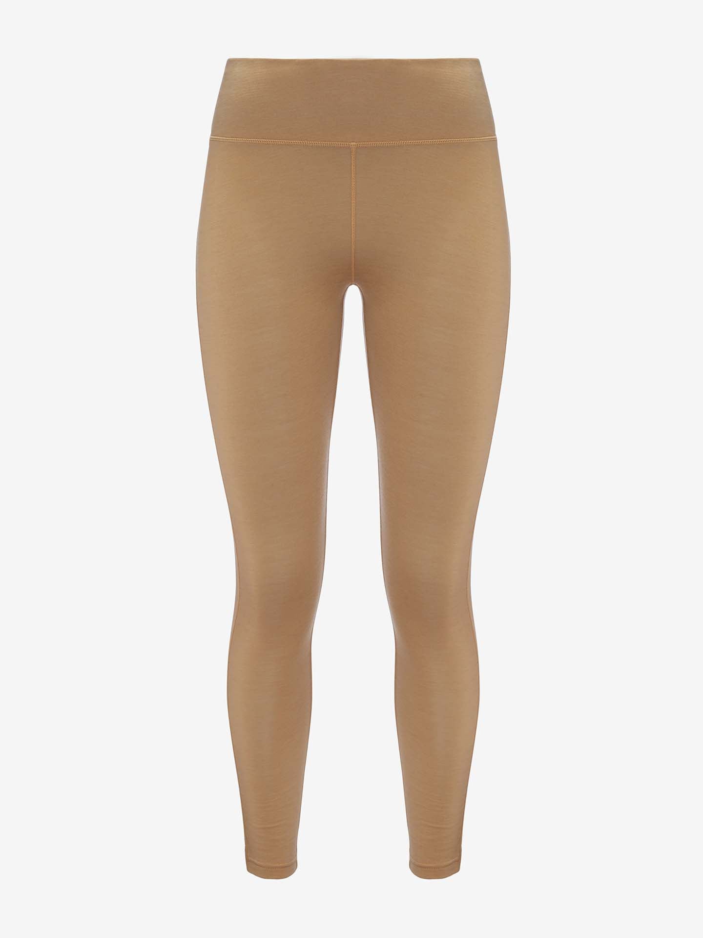 The Sno Merino Leggings Women by We Norwegians, a pair of tan-colored, high-waisted leggings made from breathable fabric, are displayed against a white background. These leggings feature a smooth, seamless design with no visible logos or patterns.