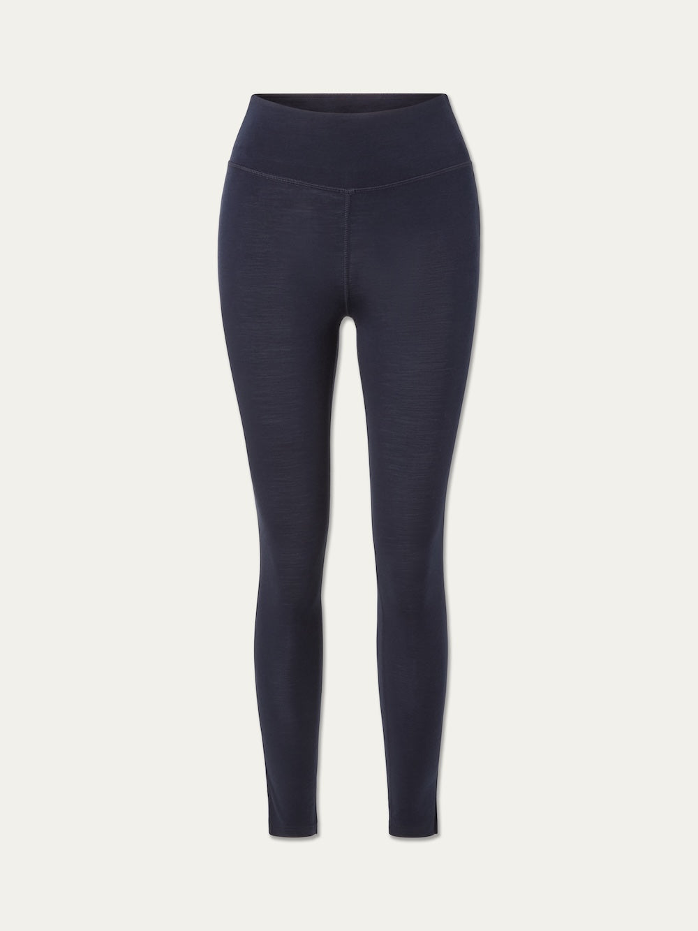 The We Norwegians Sno Merino Leggings Women are high-waisted, full-length navy blue leggings made from merino wool, shown against a plain white background—ideal as a Scandinavian base layer for superior comfort and breathability.