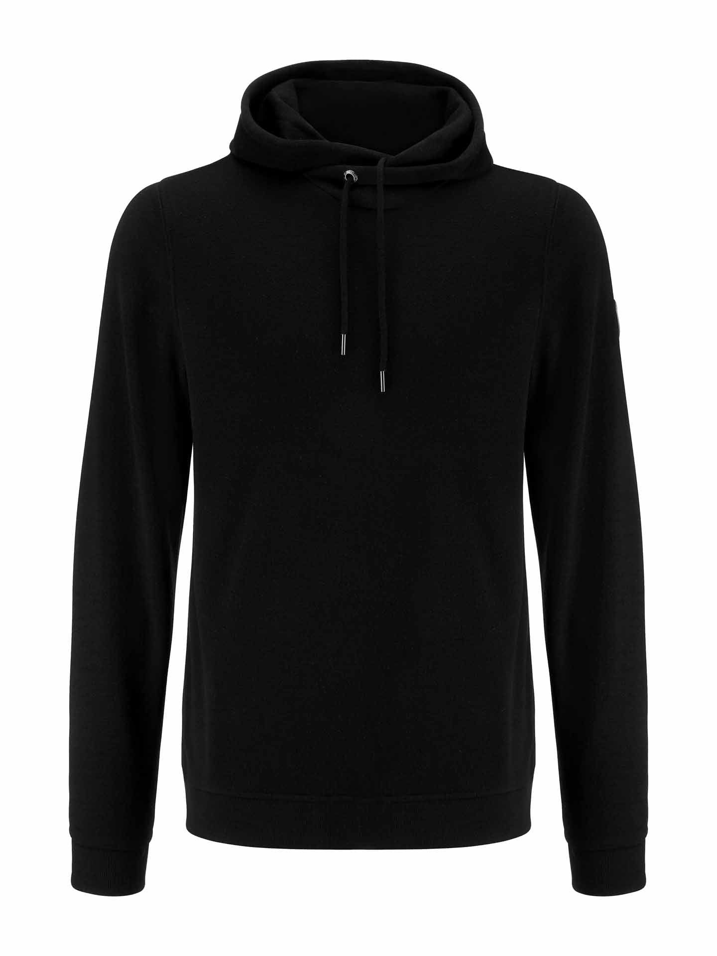 The Tind Hoodie Men Black from We Norwegians is a plain black hoodie with long sleeves and a front pocket. Crafted from Superfine Merino, it features drawstrings on the hood for adjustment. The design is simple and unadorned, providing a classic, versatile look suitable for various casual occasions while offering breathable and antibacterial properties.