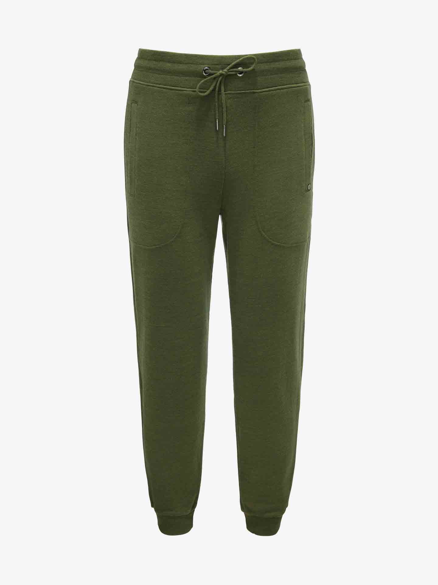 A pair of Tind Joggers Men in olive green from We Norwegians, featuring a drawstring waist and two side pockets. These Merino wool joggers have a relaxed fit and ribbed cuffs at the ankles, crafted from a soft, comfortable fabric that's naturally antibacterial.