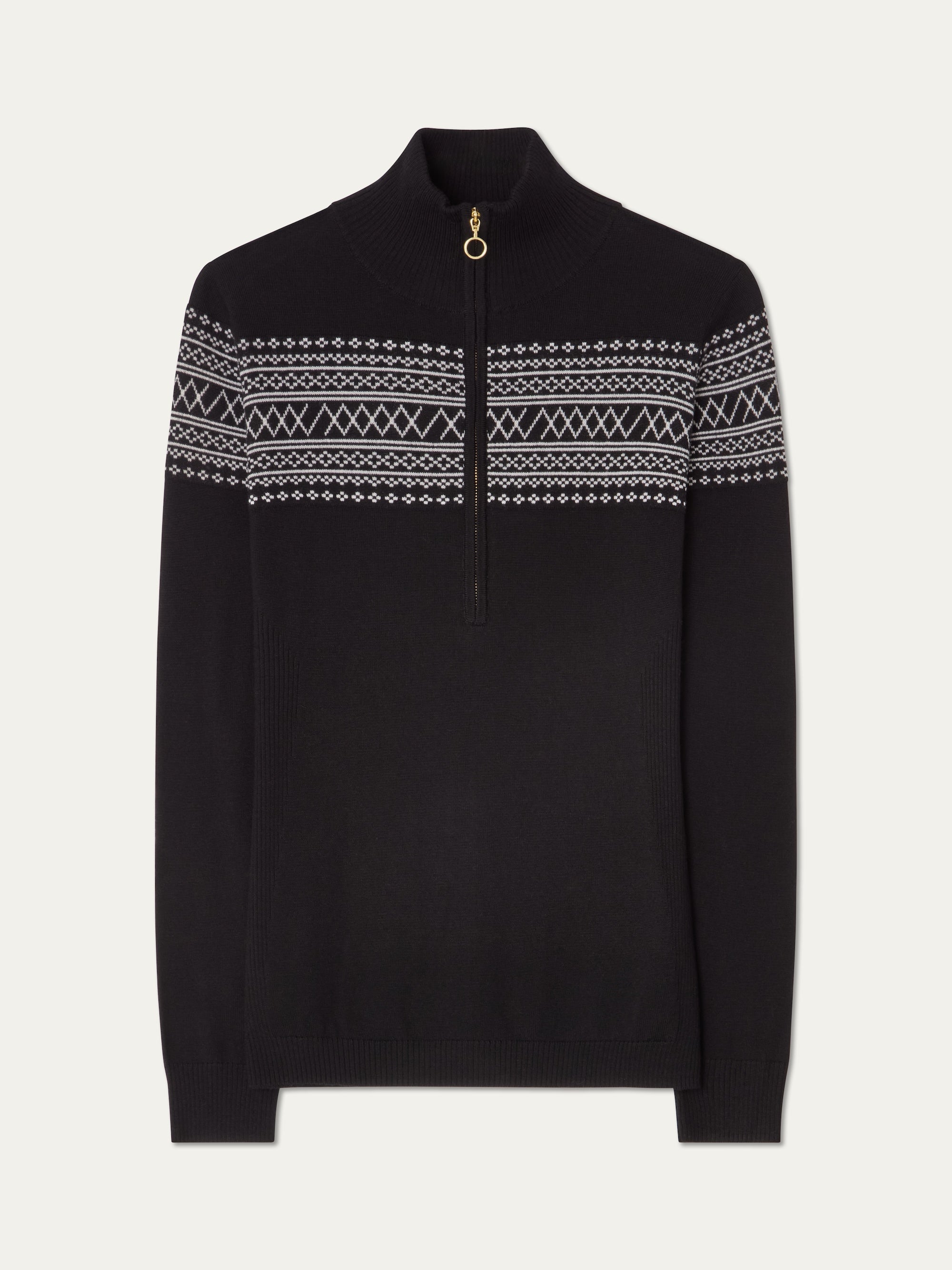 The We Norwegians Signature Zip Up Women is a black knit pullover with a half-zip, high collar, and white Setesdal pattern, made from washable merino yarn for comfort and easy care.