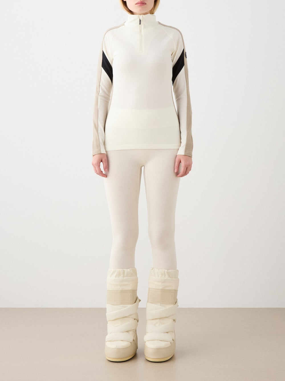 We Norwegians | FW25 | Womens Ski Basic legging_Off white | Model is wearing these fine pair of knitted leggings that make a perfect base layer | Image shot against an off-white background | Front