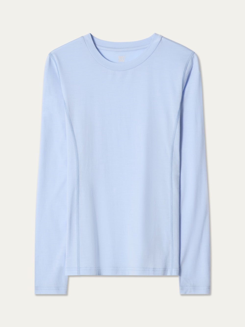 The Sno Merino Crewneck Women by We Norwegians is a plain, long-sleeve, light blue jersey shirt with a crew neck, shown on a neutral background.