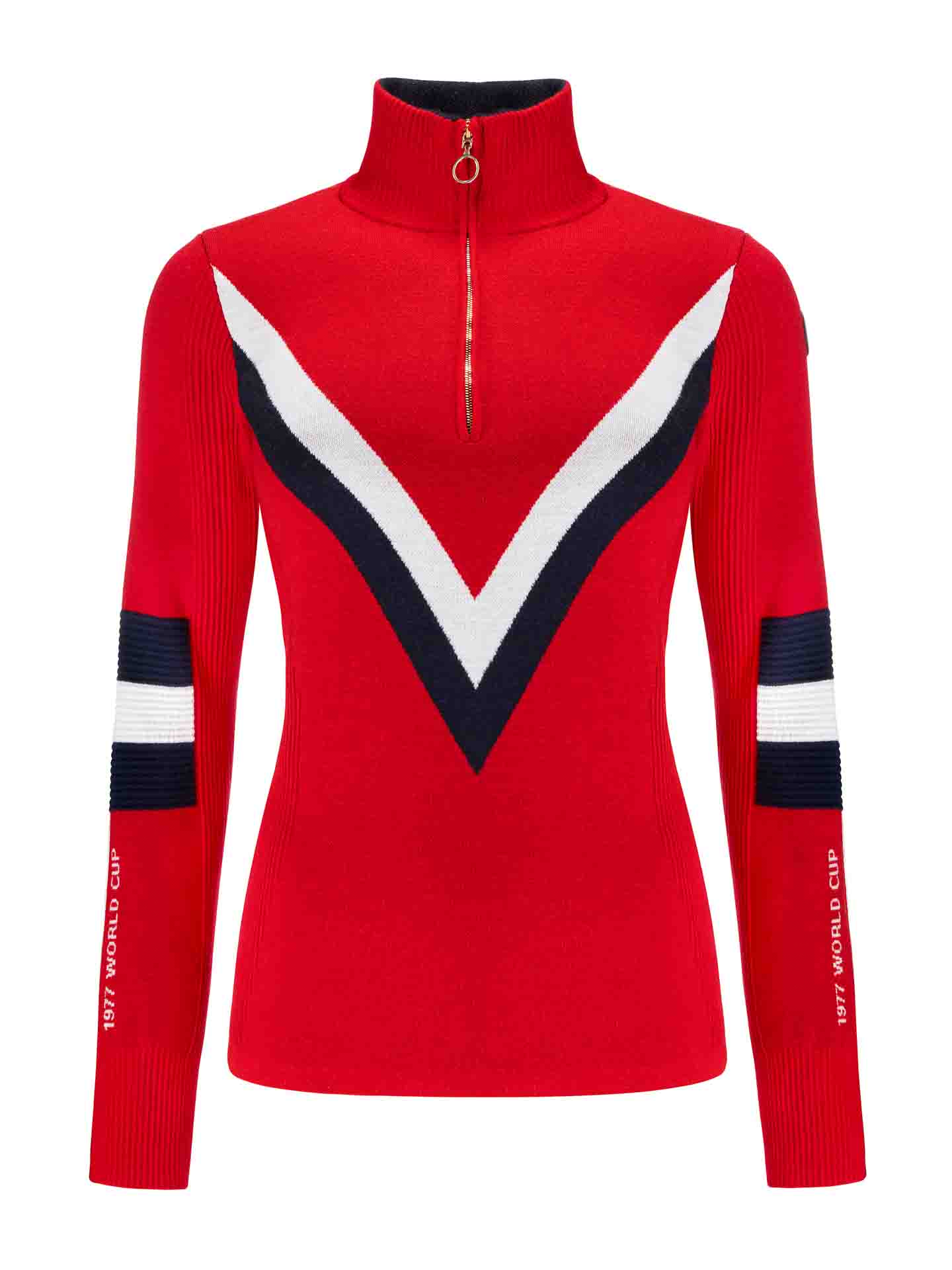 The Hafjell Zip Up Women by We Norwegians is a red, long-sleeve sweater made from fine merino wool. It features a high neck with a partial zipper. Crafted by skilled Italian knitters, the front showcases bold white and navy V-shaped stripes, while the sleeves have similar stripes and "1977 WORLD CUP" written on the left sleeve, evoking classic ski sweaters.